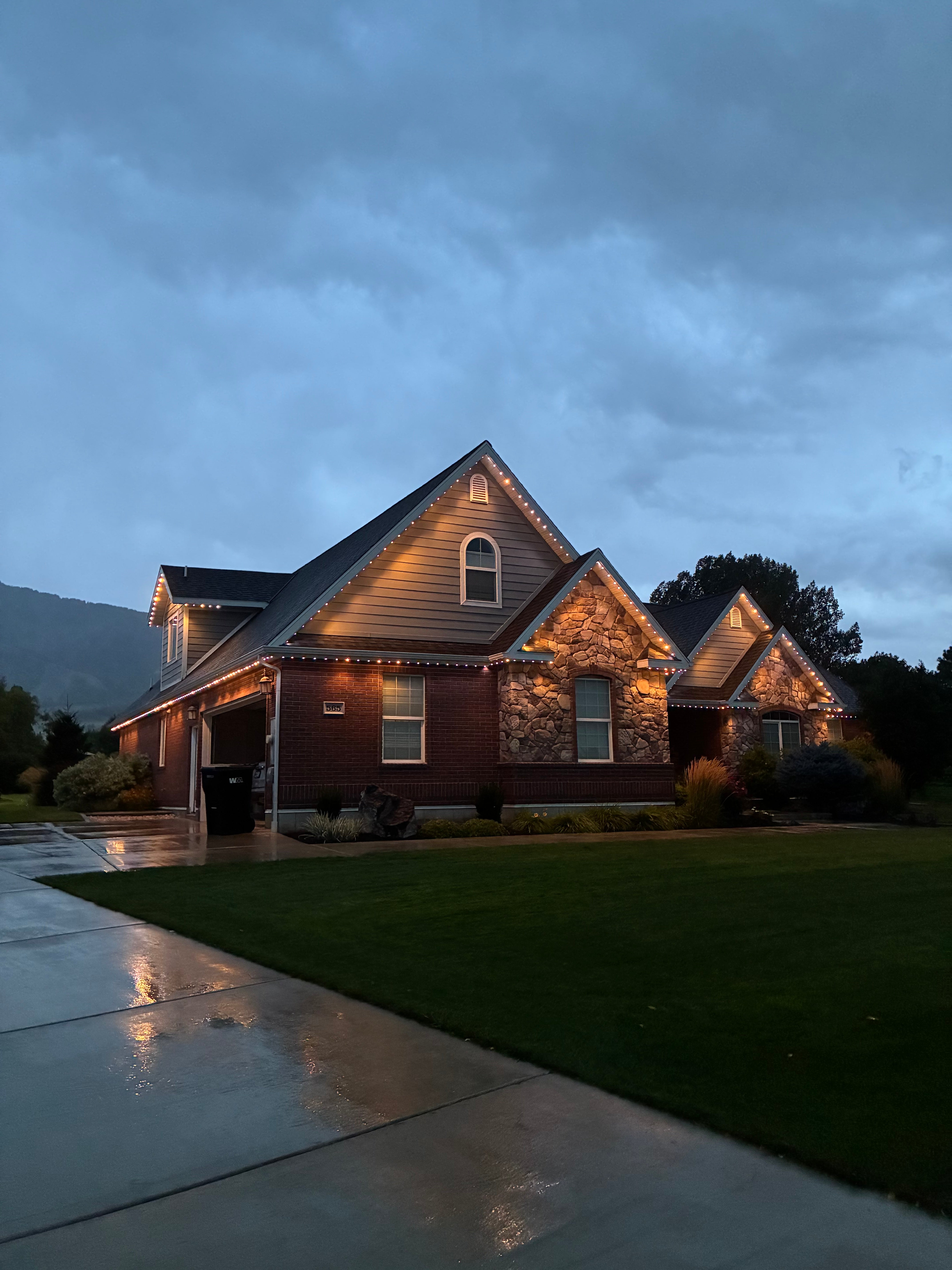 Craftsman home, warm white at dusk